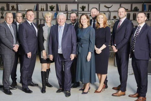 Bob Weston and the Weston Homes directors stood in the atrium of the Innovation Centre at Head Office in Takeley